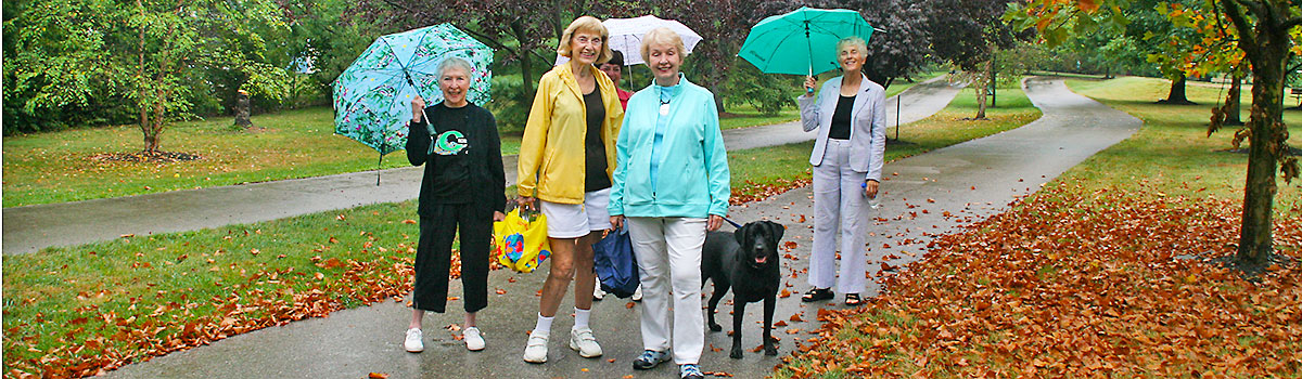 women walking on juilfs park trail in the fall