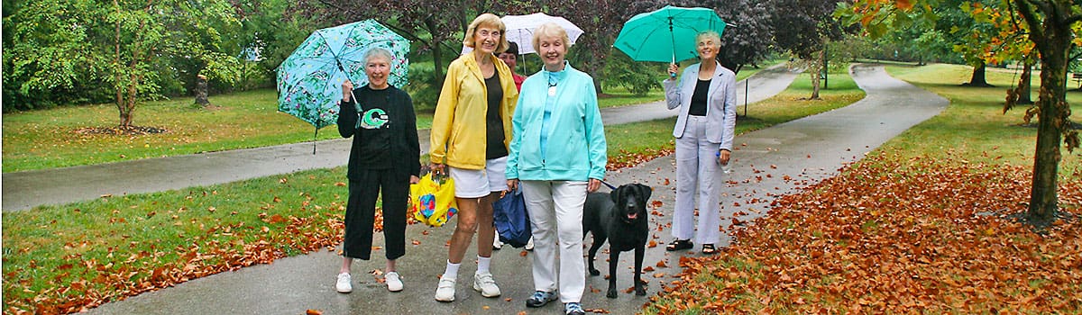 women walking on juilfs park trail in the fall