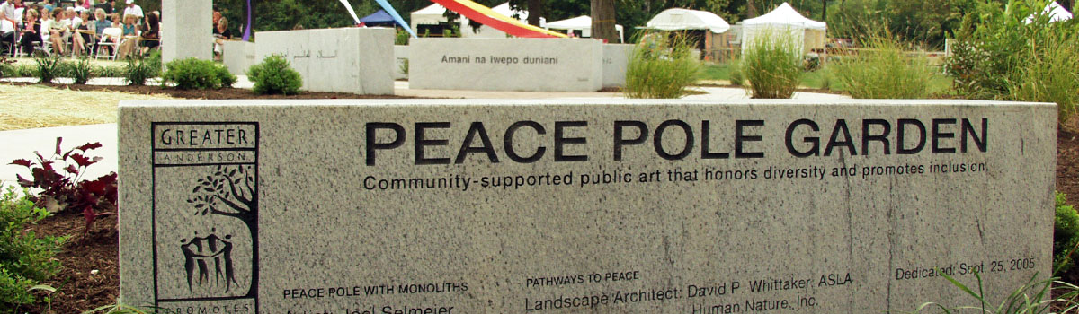 There are 12 different translations of “May Peace Prevail on Earth” inscribed on six stone monoliths surrounding a smooth 9-ft. granite pole.
